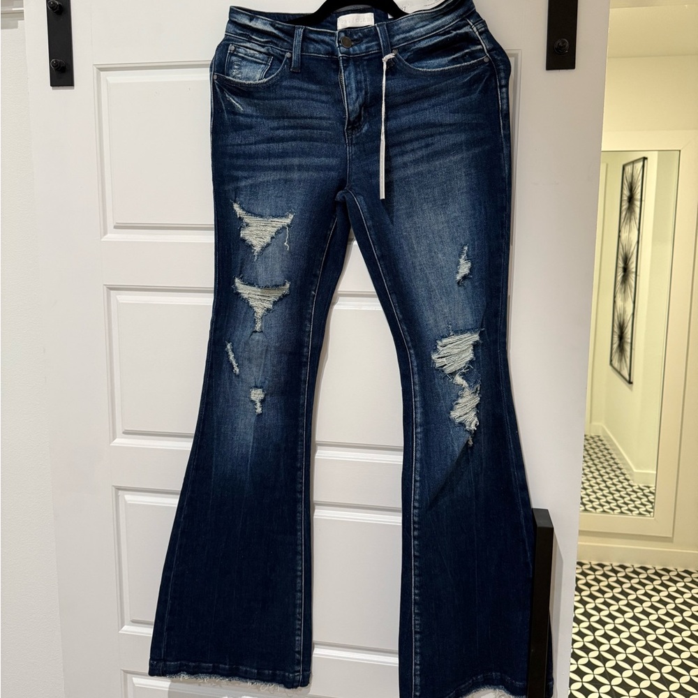 NWT Petra 153. DISTRESSED MID RISE STRETCH FLARE WITH TROUSER HEM.